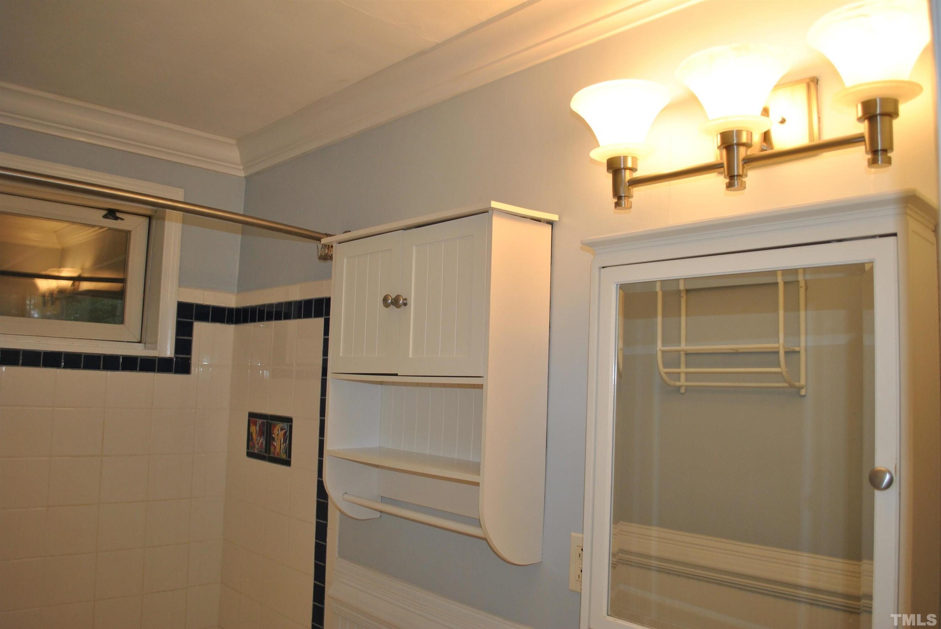 2106 Brewer Street Raleigh, NC 27608 - Photo 32 of 38 a bathroom with a shower
