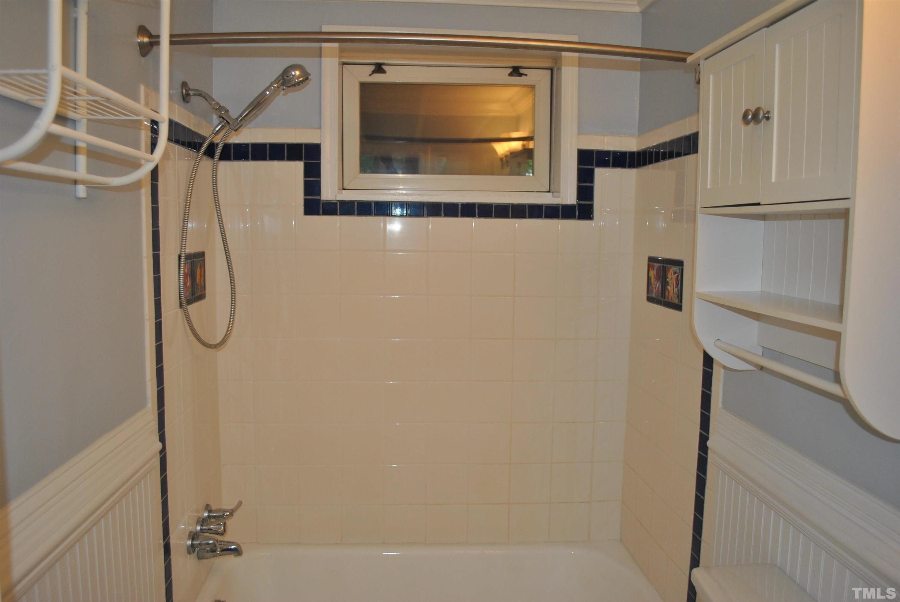 2106 Brewer Street Raleigh, NC 27608 - Photo 33 of 38 a bathroom with a shower