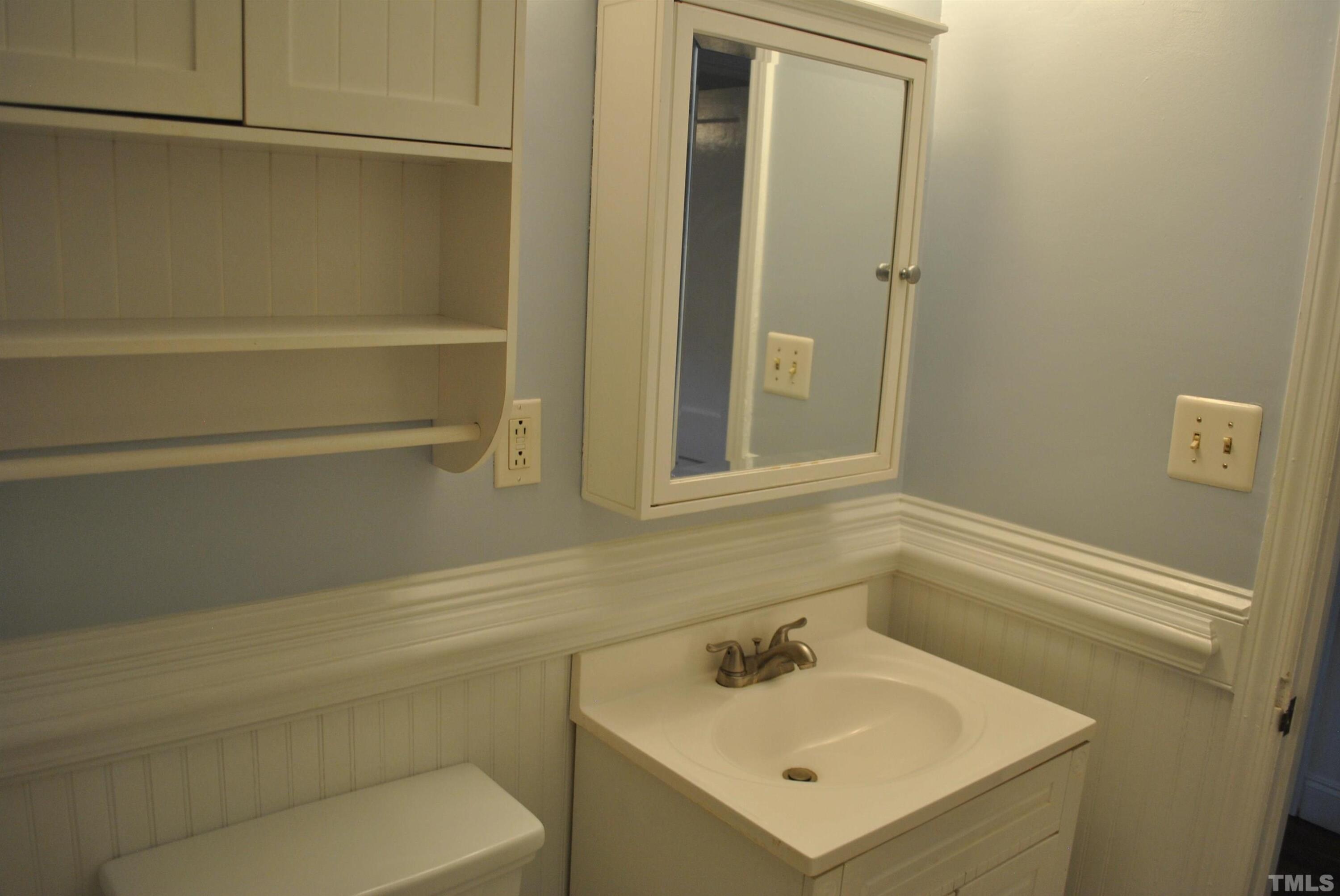 2106 Brewer Street Raleigh, NC 27608 - Photo 34 of 38 a bathroom with a sink and a vanity