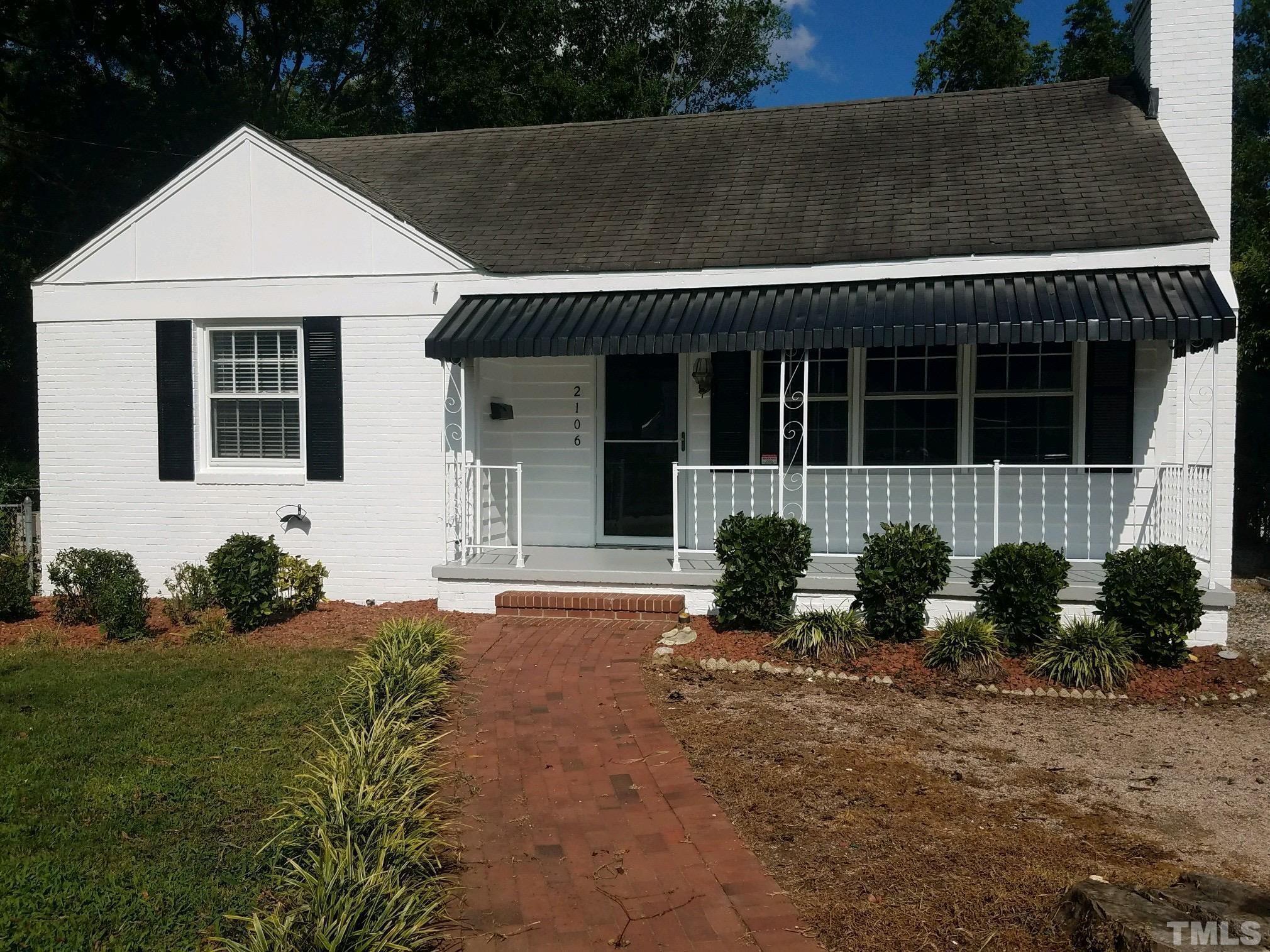 2106 Brewer Street Raleigh, NC 27608 - Photo 36 of 38 a front view of a house with a yard
