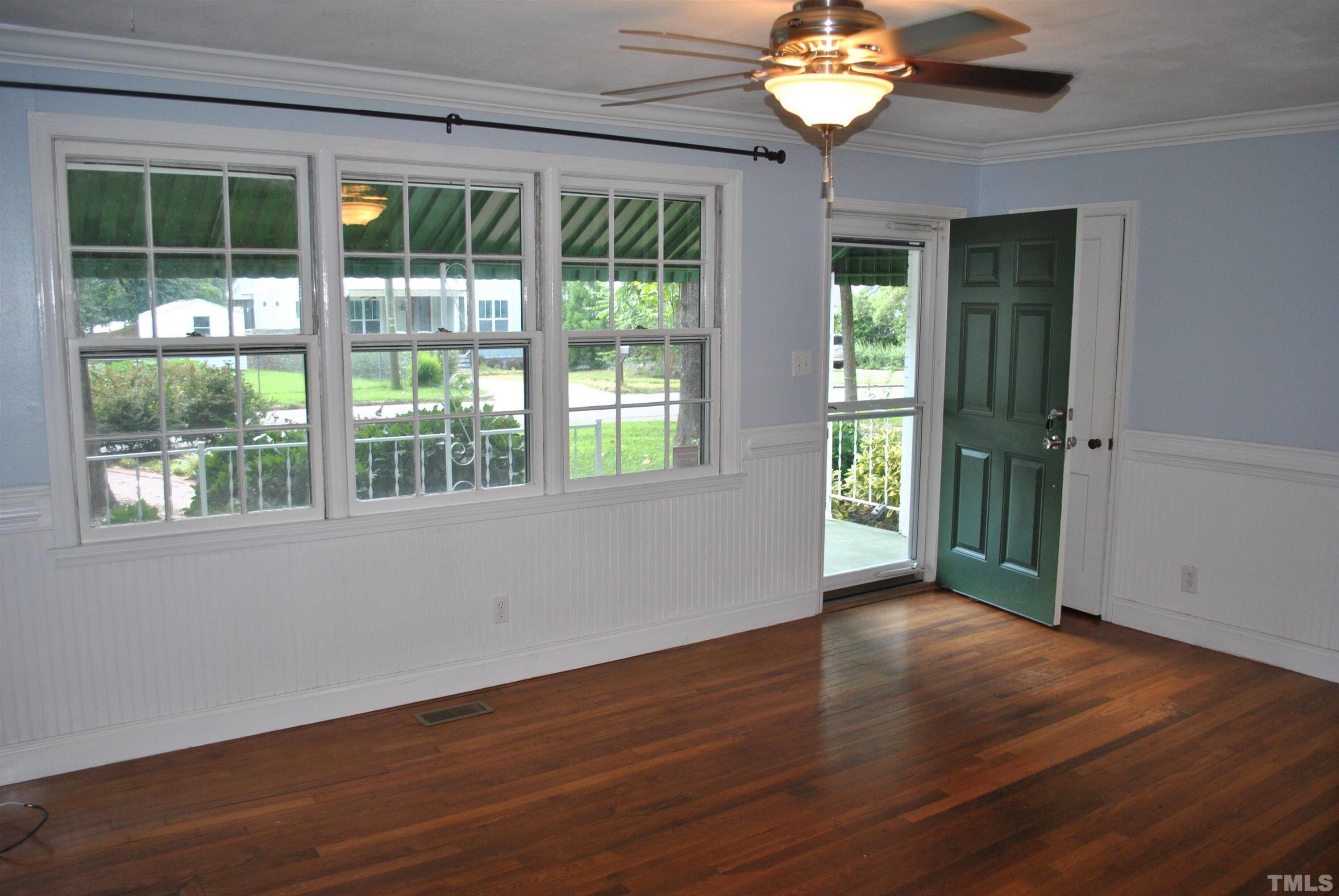 2106 Brewer Street Raleigh, NC 27608 - Photo 4 of 38 a view of wooden floor and a chandelier in a room