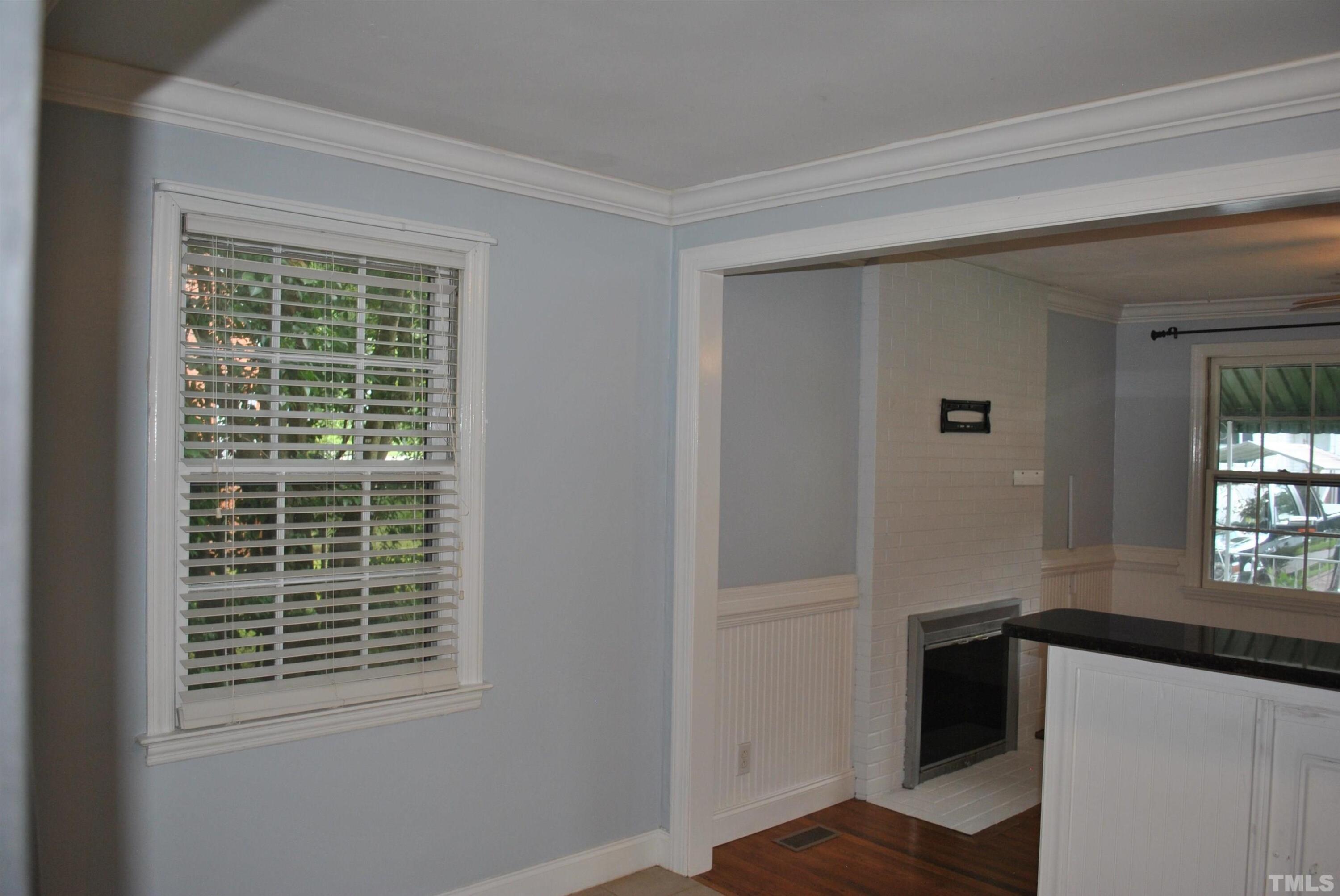 2106 Brewer Street Raleigh, NC 27608 - Photo 5 of 38 a view of an empty room with a window
