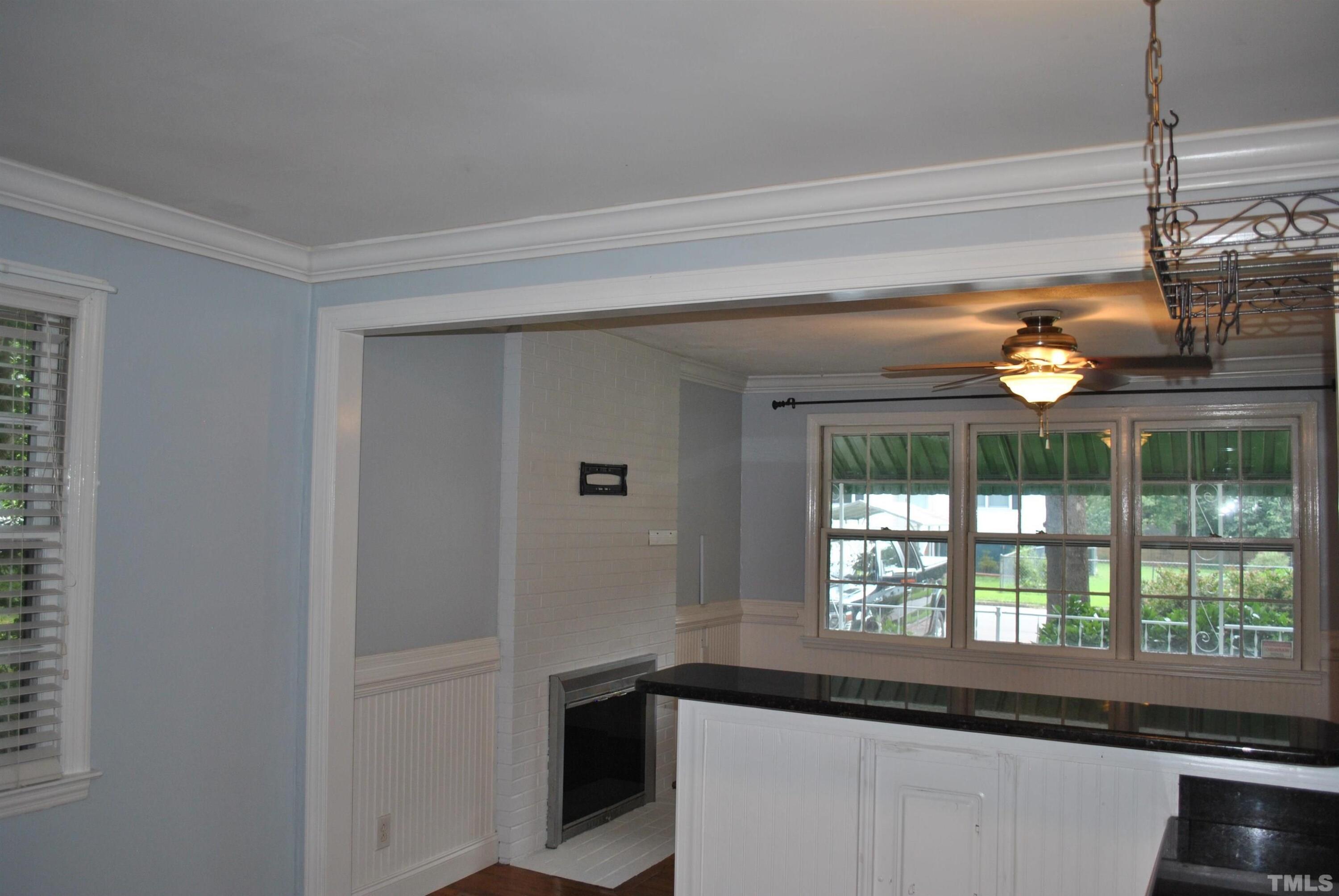 2106 Brewer Street Raleigh, NC 27608 - Photo 7 of 38 a view of a living room and a window