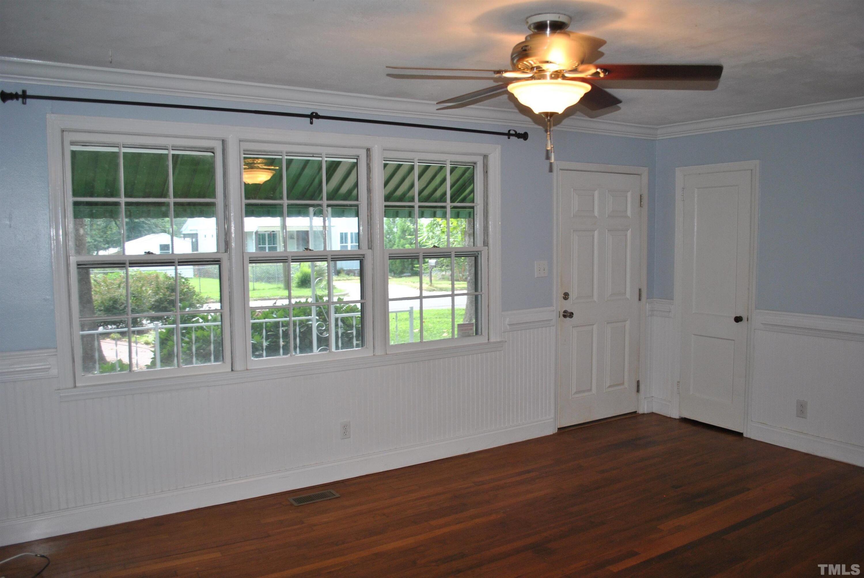 2106 Brewer Street Raleigh, NC 27608 - Photo 9 of 38 a view of a chandelier fan and wooden floor