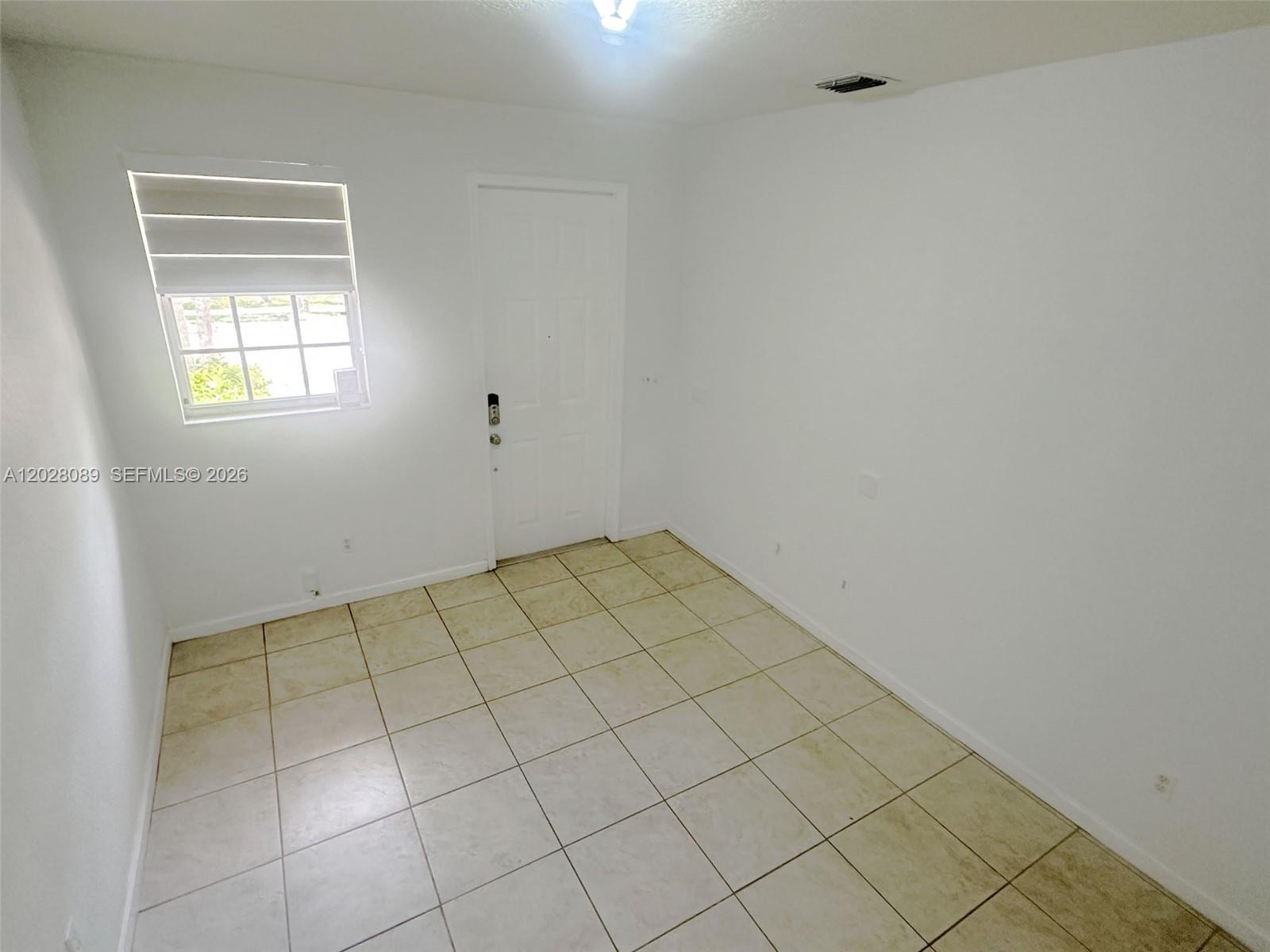 662 Northeast 21st Terrace Homestead, FL 33033 - Photo 5 of 34 a view of a room and window