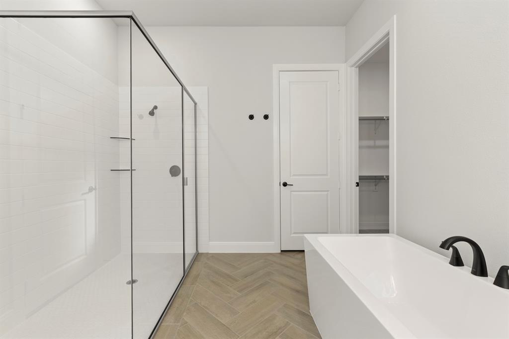 912 Firewood Way Anna, TX 75409 - Photo 17 of 29 a bathroom with a sink and shower