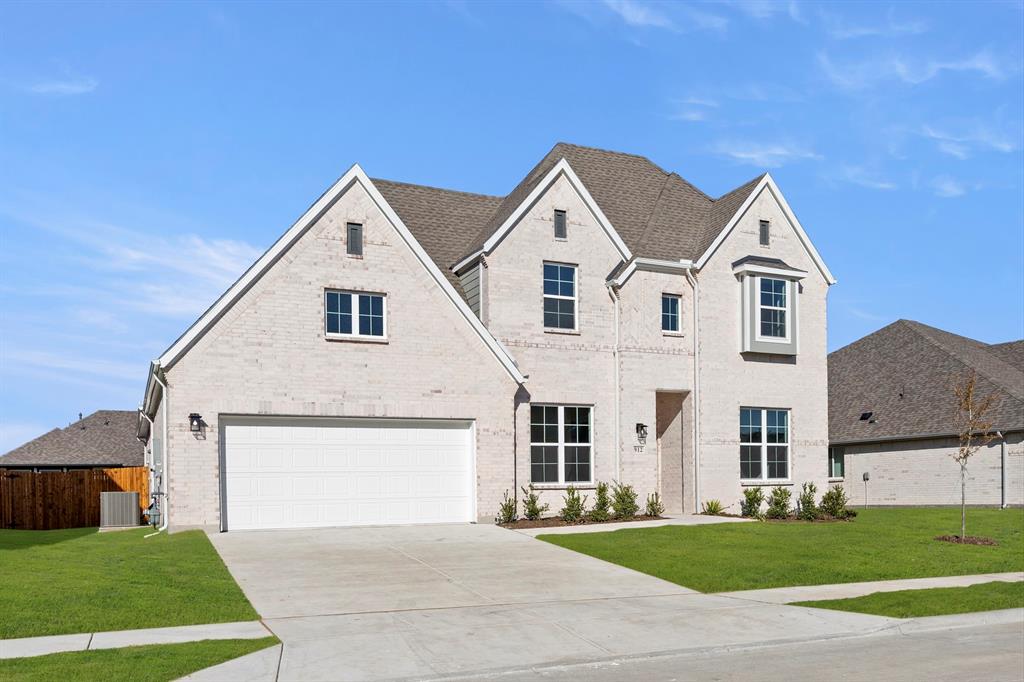 912 Firewood Way Anna, TX 75409 - Photo 2 of 29 a front view of a house with a yard and garage