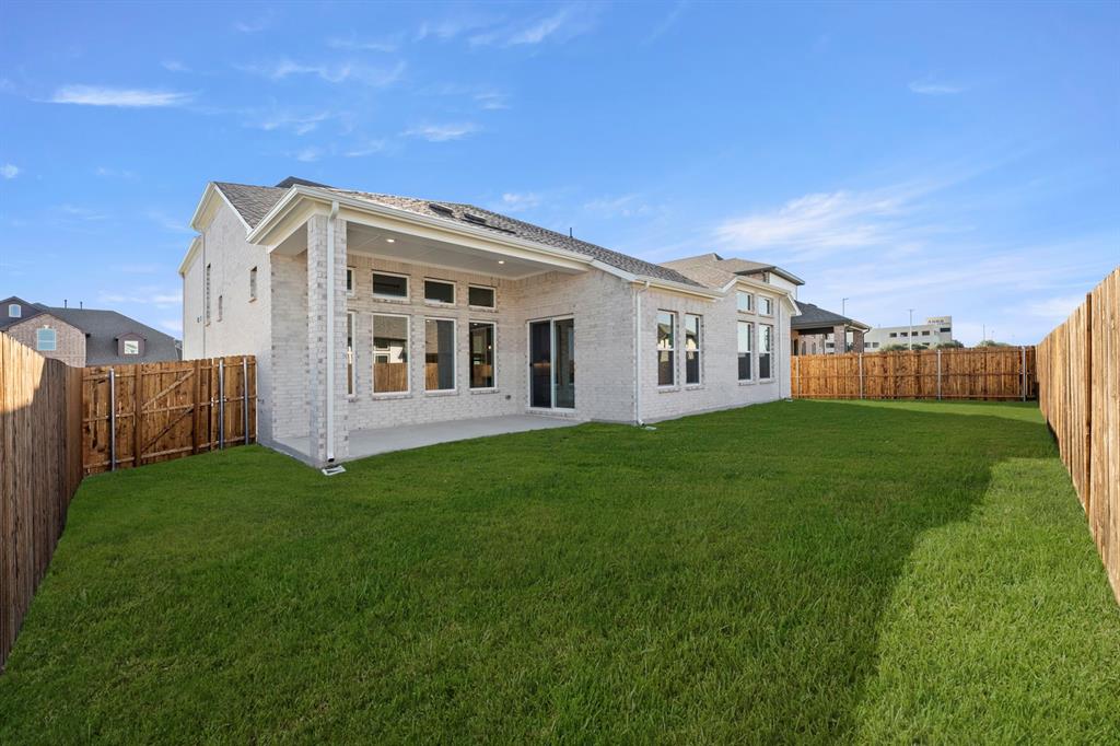 912 Firewood Way Anna, TX 75409 - Photo 26 of 29 a view of a house with backyard and porch