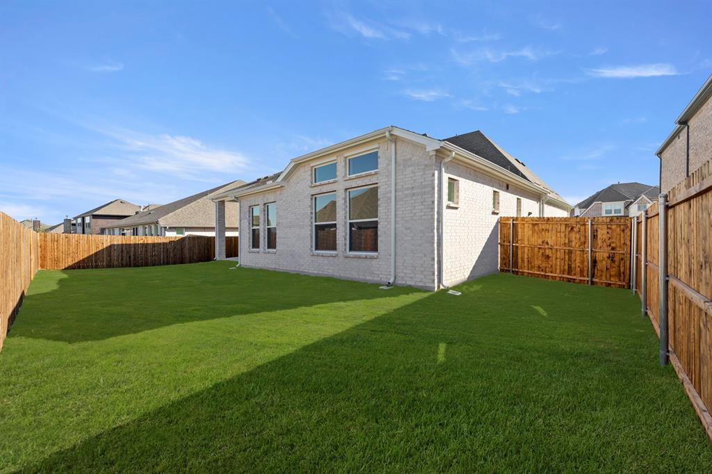 912 Firewood Way Anna, TX 75409 - Photo 27 of 29 a view of an house with backyard and porch
