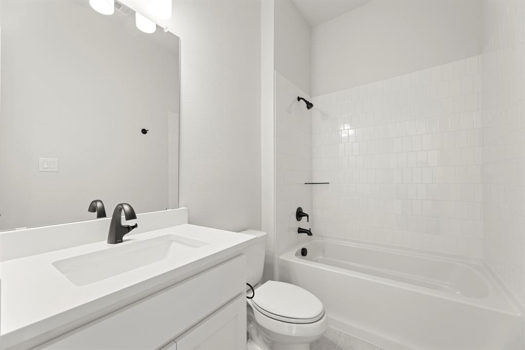 912 Firewood Way Anna, TX 75409 - Photo 6 of 29 a bathroom with a sink a toilet and shower