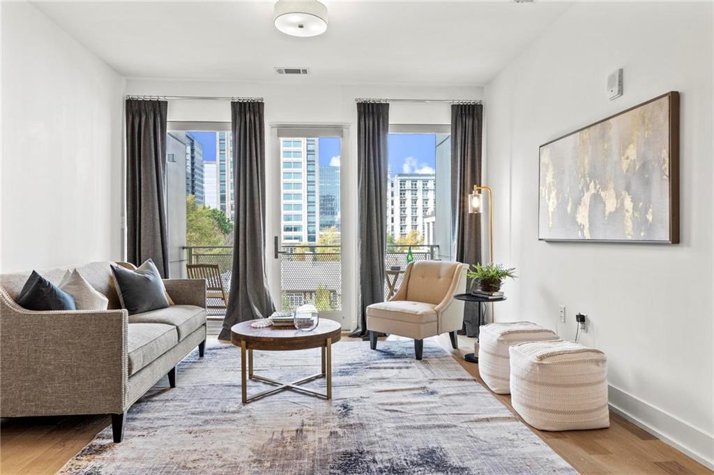 a living room with furniture and a large window