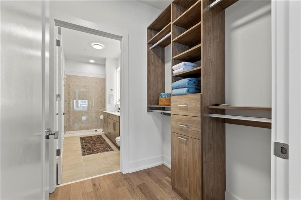 775 Juniper Street Northeast, Unit 613 Atlanta, GA 30308 - Photo 13 of 39 a view of walk in closet with empty racks