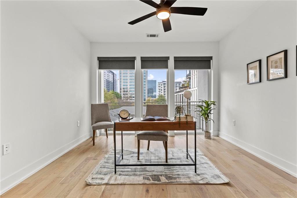 775 Juniper Street Northeast, Unit 613 Atlanta, GA 30308 - Photo 15 of 39 a view of a dining room with furniture and window