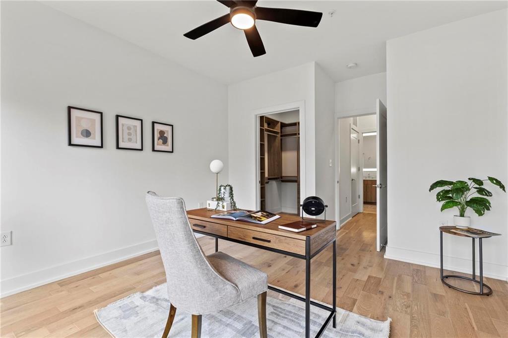 775 Juniper Street Northeast, Unit 613 Atlanta, GA 30308 - Photo 16 of 39 a view of a workspace with furniture and wooden floor
