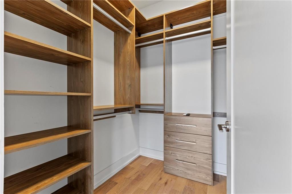 775 Juniper Street Northeast, Unit 613 Atlanta, GA 30308 - Photo 17 of 39 a view of walk in closet with empty racks