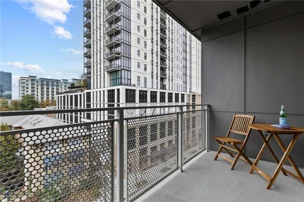 a view of a balcony with a bench
