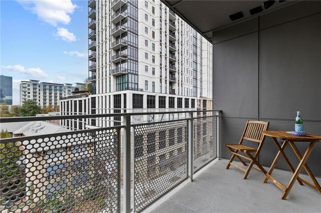 775 Juniper Street Northeast, Unit 613 Atlanta, GA 30308 - Photo 19 of 39 a view of a balcony with a bench