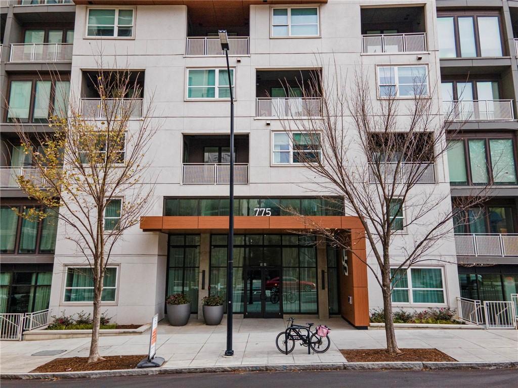 775 Juniper Street Northeast, Unit 613 Atlanta, GA 30308 - Photo 23 of 39 a view of a brick building with many windows