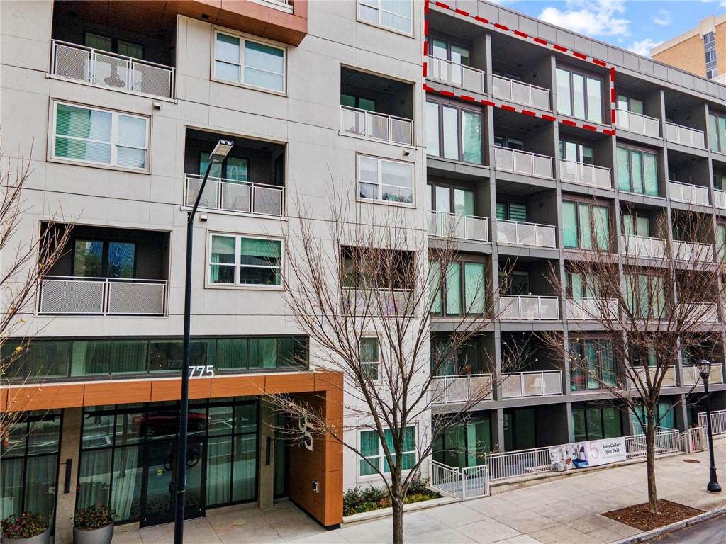 775 Juniper Street Northeast, Unit 613 Atlanta, GA 30308 - Photo 24 of 39 a front view of a building with balcony