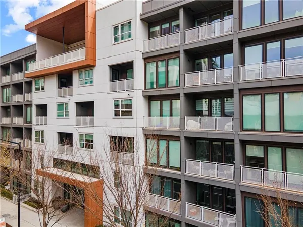 a front view of a building with a lot of windows