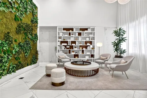 a living room with furniture and a potted plant