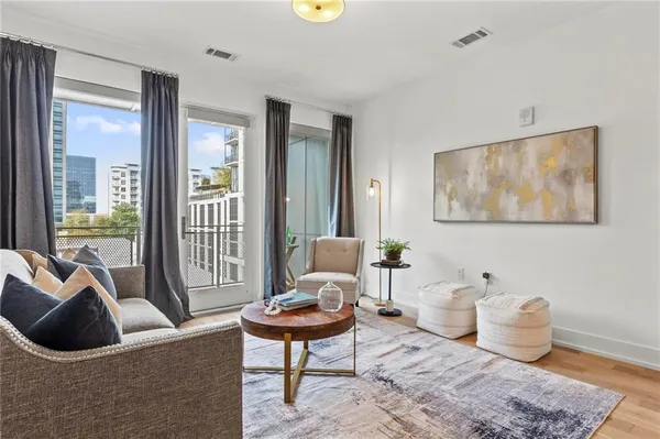 a living room with furniture and a window
