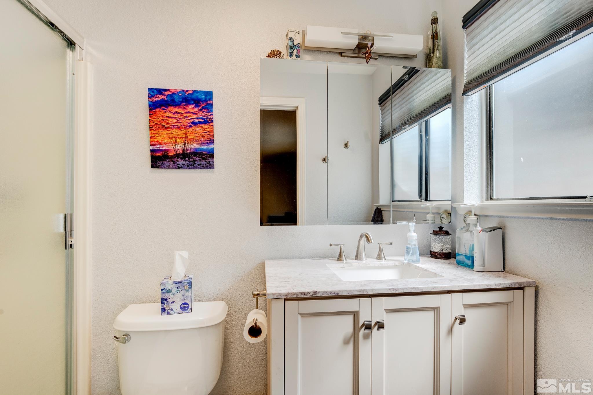 1000 Roberts Street Reno, NV 89502 - Photo 14 of 40 a bathroom with a sink and a mirror