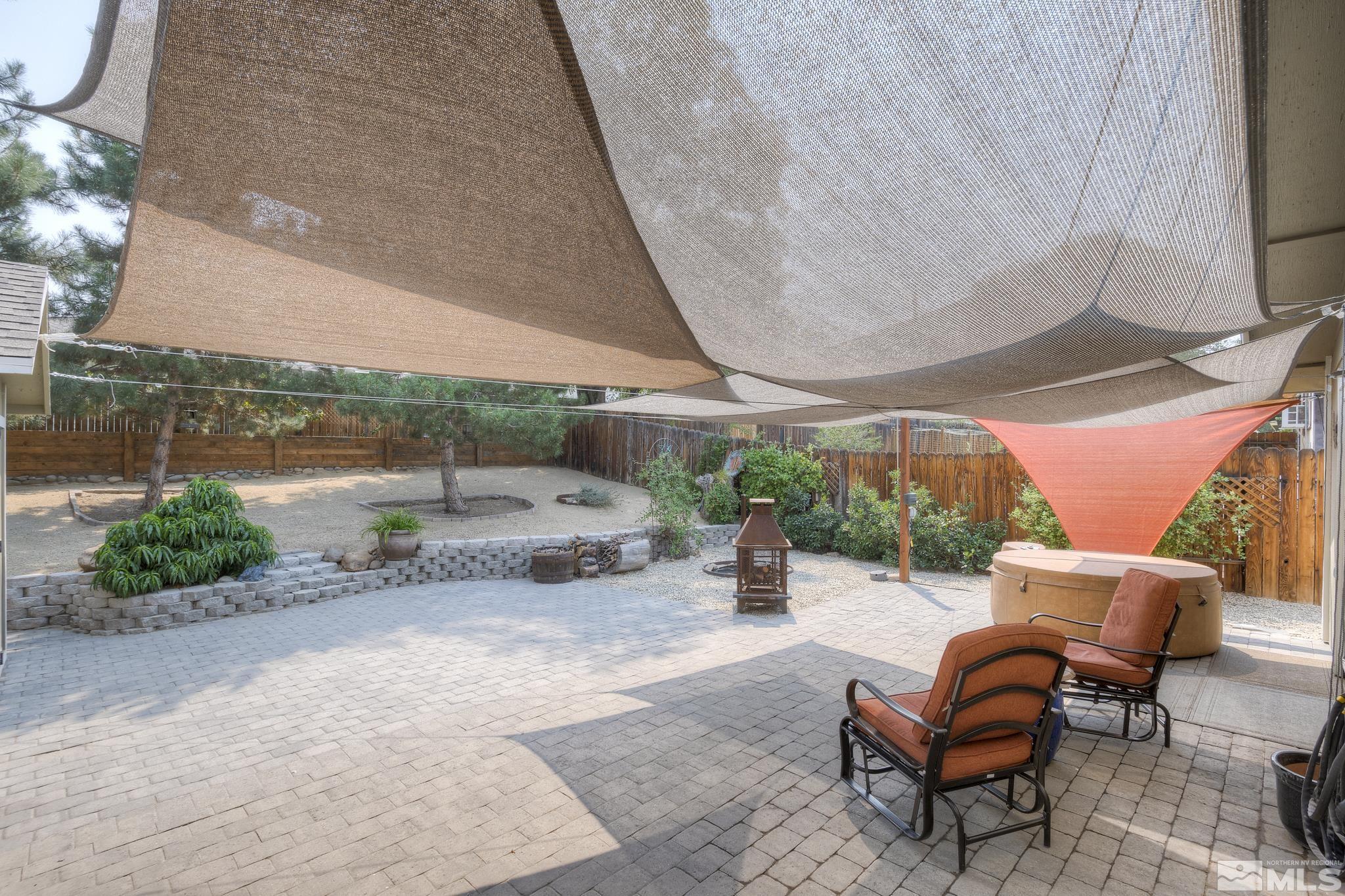 1000 Roberts Street Reno, NV 89502 - Photo 20 of 40 a view of a patio with a table and chairs under an umbrella with a patio