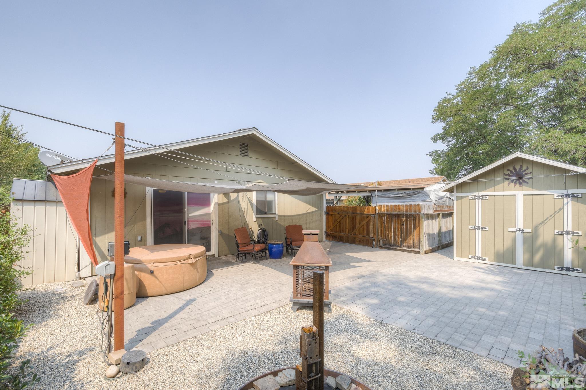 1000 Roberts Street Reno, NV 89502 - Photo 2 of 40 a front view of a house with a yard and garage