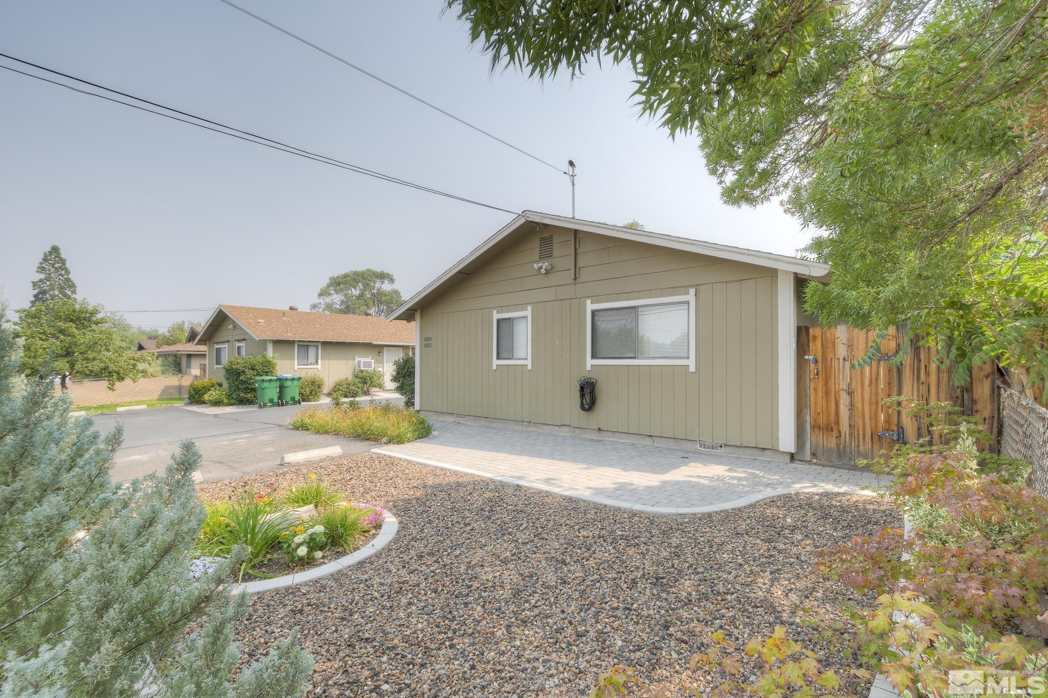 1000 Roberts Street Reno, NV 89502 - Photo 37 of 40 a view of backyard of house with outdoor seating and green space