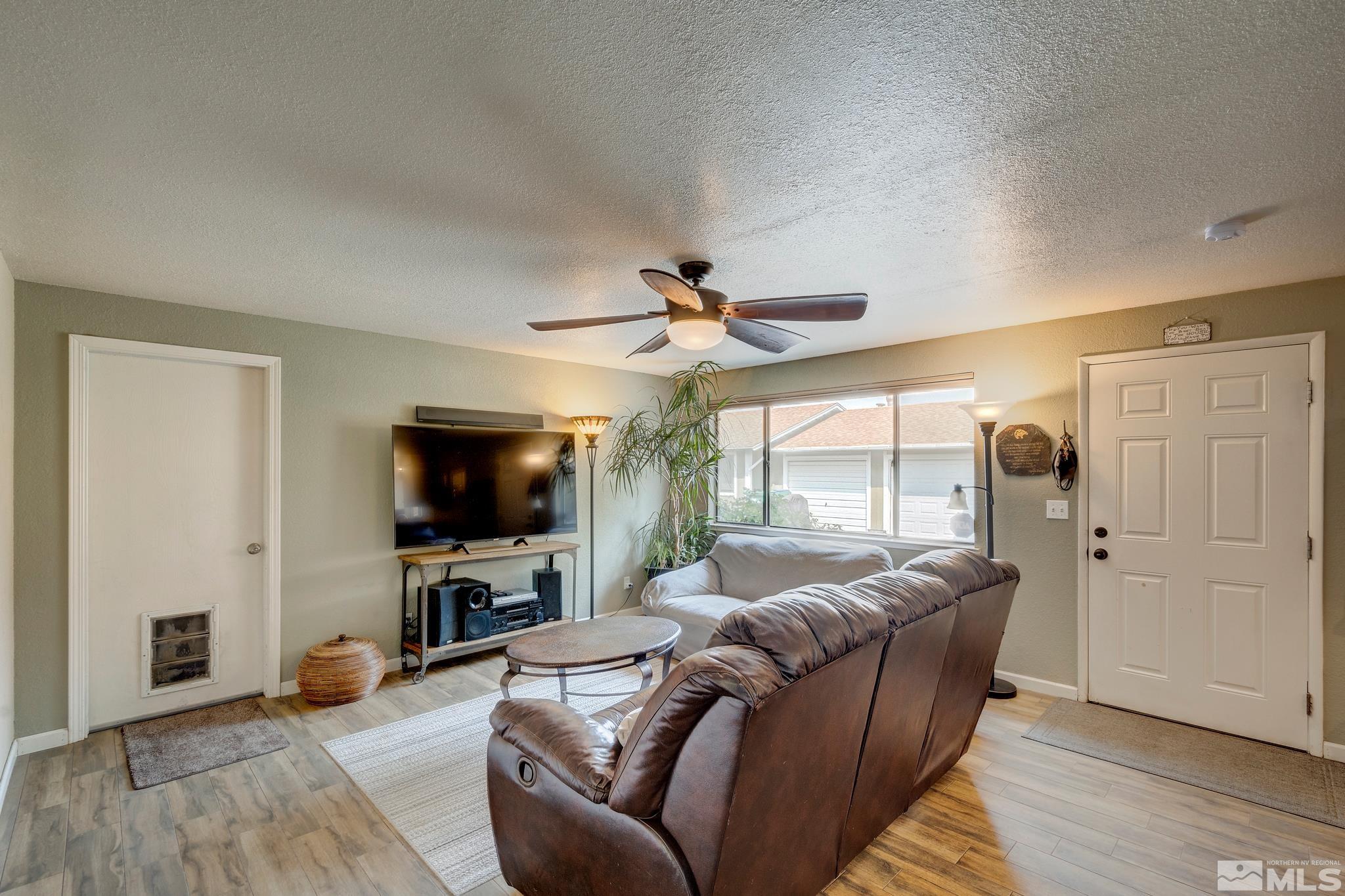 1000 Roberts Street Reno, NV 89502 - Photo 8 of 40 a living room with furniture and a flat screen tv