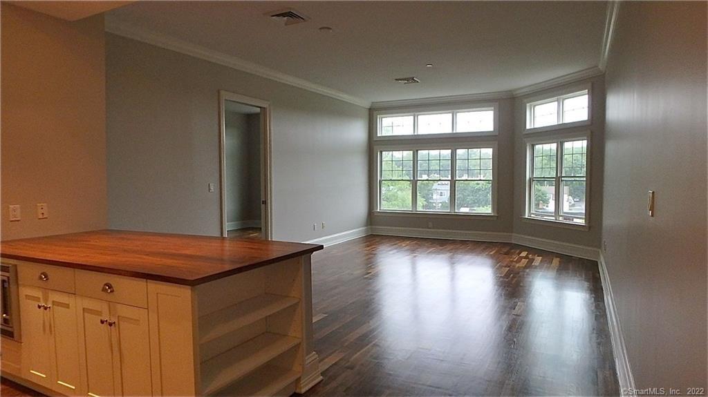 75 Stone Ridge Way, Unit 3E Fairfield, CT 06824 - Photo 23 of 23 Open floor plan is great for entertaining. Hardwood floors and large bay windows add beauty and natural light to this lovely home.