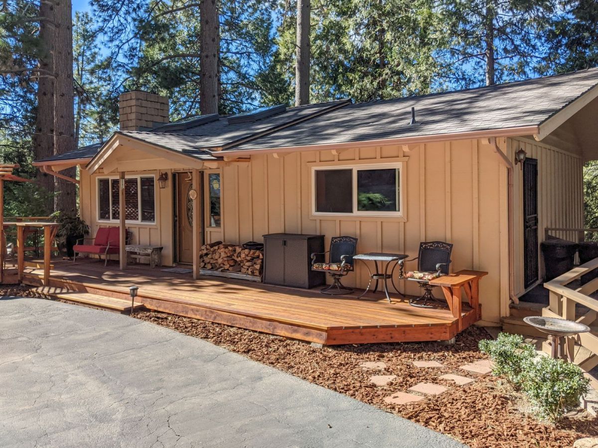 25915 Wayne Road Idyllwild, CA 92549 - Photo 2 of 69 a view of a house with backyard and sitting area