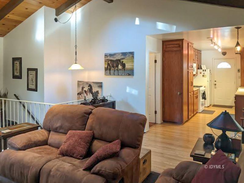 25915 Wayne Road Idyllwild, CA 92549 - Photo 14 of 69 a bedroom with furniture and a wooden floor