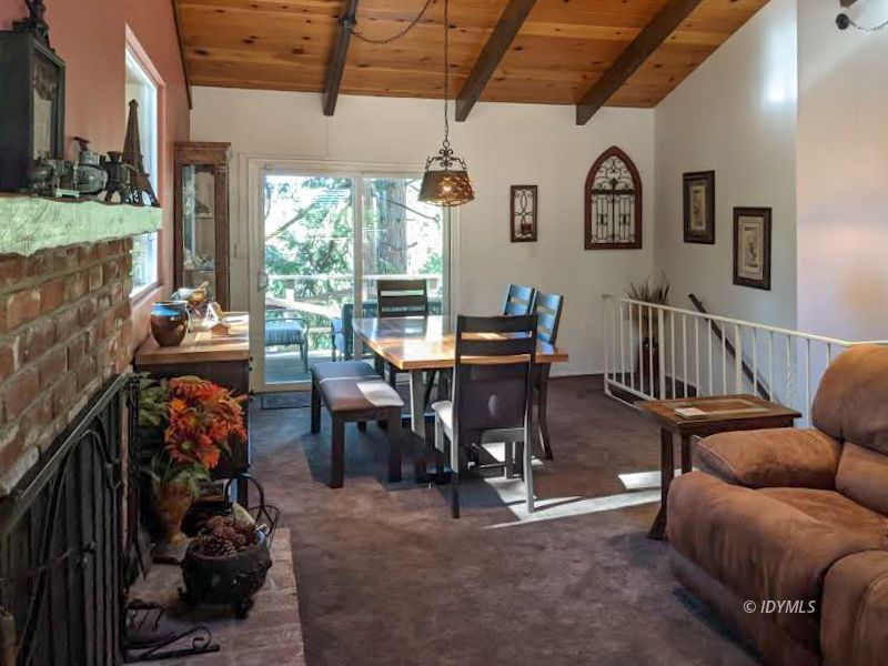 25915 Wayne Road Idyllwild, CA 92549 - Photo 16 of 69 a view of a livingroom with furniture and a table