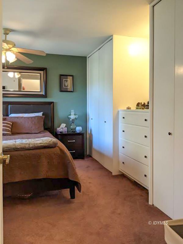 25915 Wayne Road Idyllwild, CA 92549 - Photo 30 of 69 a bedroom with a bed and windows