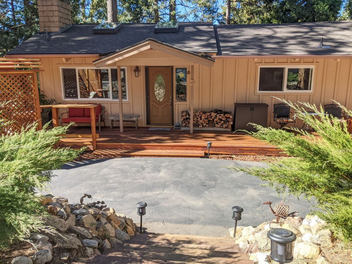 25915 Wayne Road Idyllwild, CA 92549 - Photo 4 of 69 a front view of a house with a yard