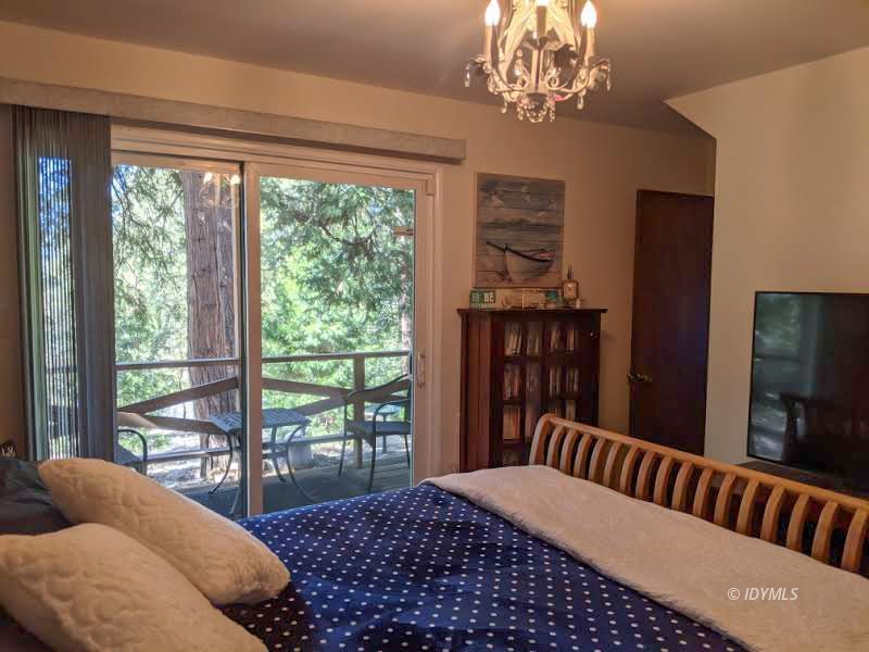 25915 Wayne Road Idyllwild, CA 92549 - Photo 36 of 69 a bedroom with a large bed and a window