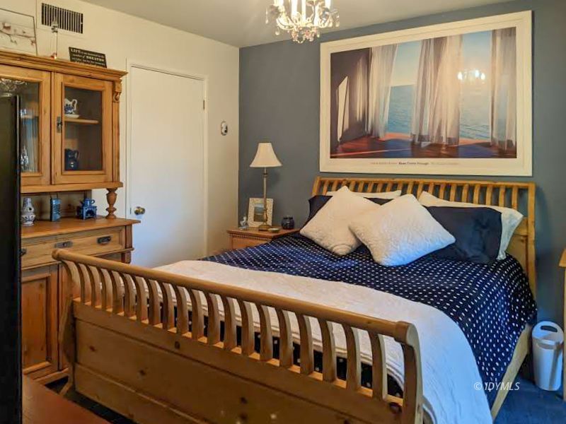 25915 Wayne Road Idyllwild, CA 92549 - Photo 38 of 69 a bedroom with a bed and wooden floor