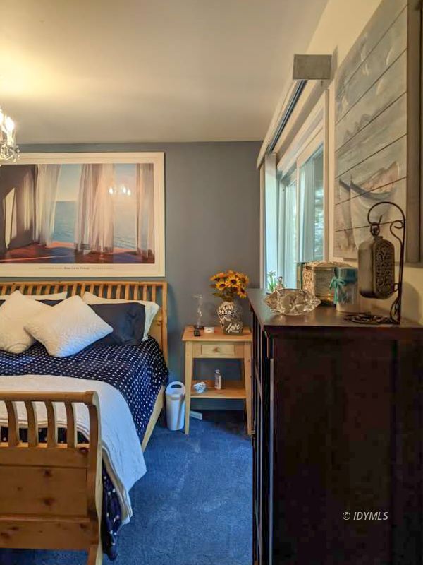 25915 Wayne Road Idyllwild, CA 92549 - Photo 39 of 69 a bedroom with a bed and wooden floor