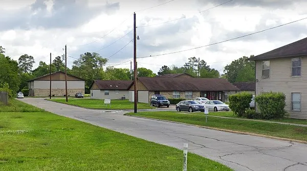 a view of a house with a yard fire pit and outdoor seating