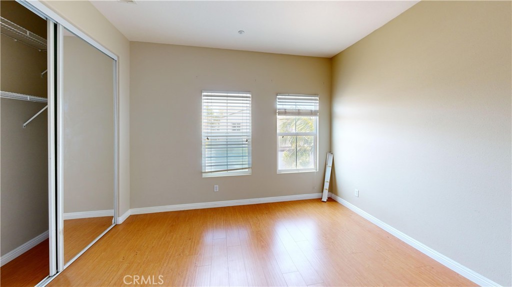 4312 Waterside Lane Oxnard, CA 93035 - Photo 13 of 23 a view of empty room with wooden floor and fan
