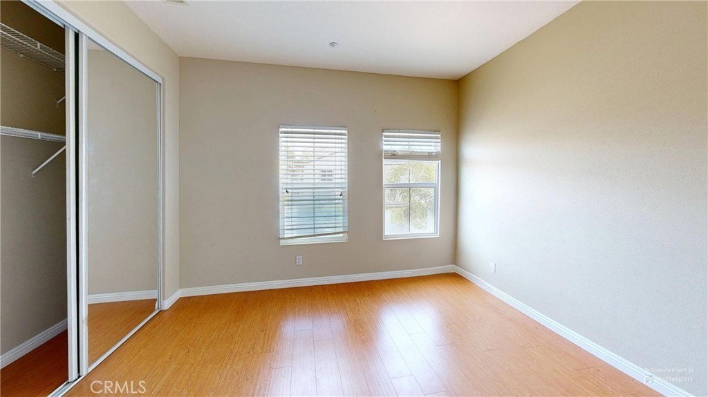 4312 Waterside Lane Oxnard, CA 93035 - Photo 15 of 23 a view of an empty room with wooden floor and a window