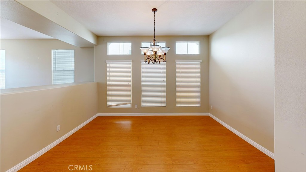 4312 Waterside Lane Oxnard, CA 93035 - Photo 16 of 23 a view of a room with window chandelier chandeliers
