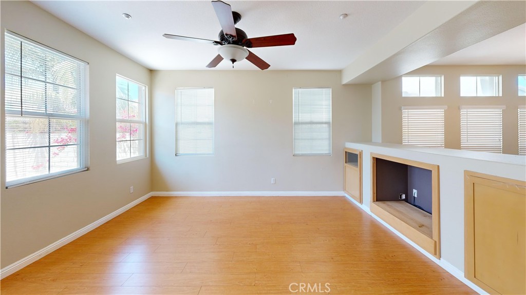 4312 Waterside Lane Oxnard, CA 93035 - Photo 6 of 23 a view of an empty room with window and wooden floor