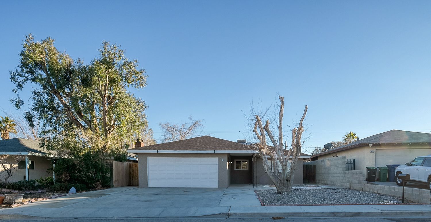 609 West Joyner Avenue Ridgecrest, CA 93555 - Photo 29 of 29 a front view of a house with a garden