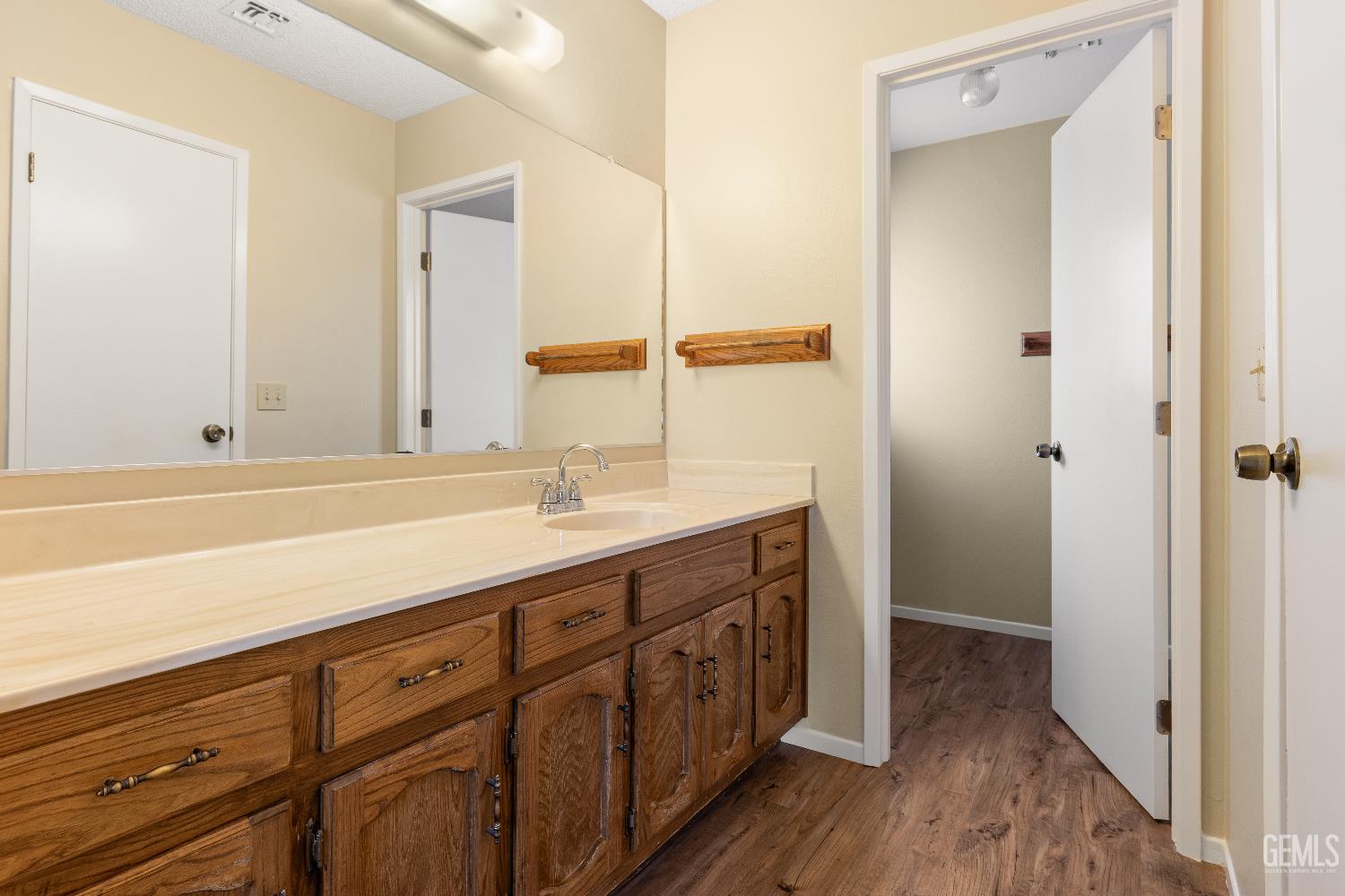 Undisclosed Address Ridgecrest, CA 93555 - Photo 16 of 25 a spacious bathroom with double vanity and mirrors