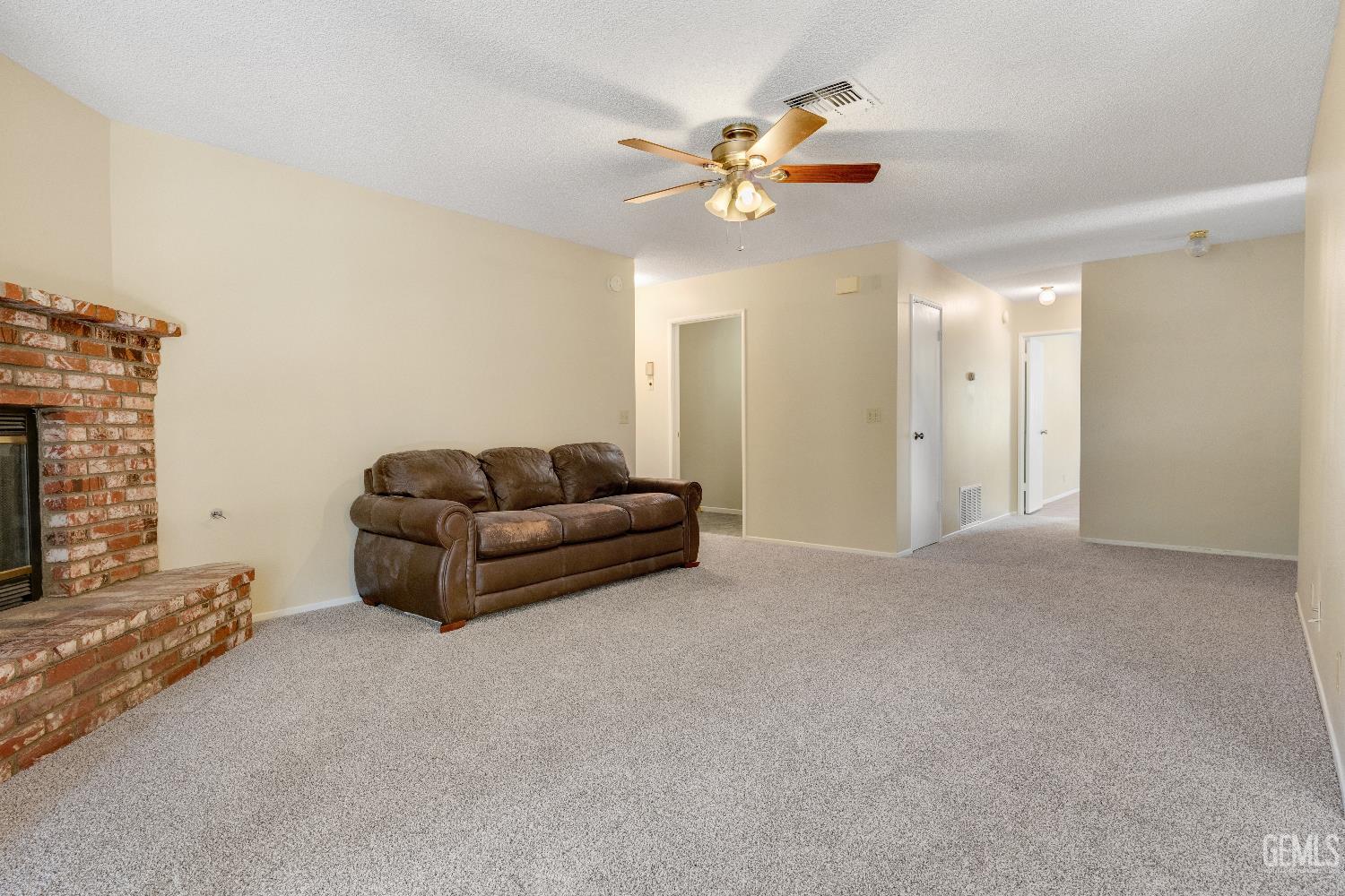 Undisclosed Address Ridgecrest, CA 93555 - Photo 5 of 25 a living room with furniture and a fireplace