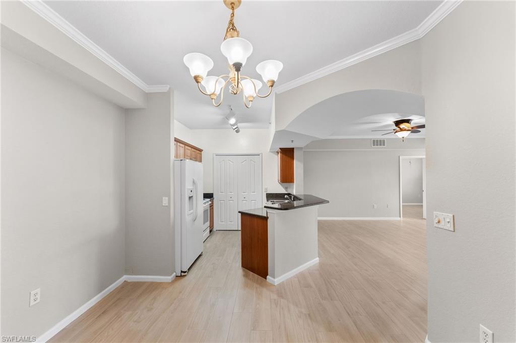 12920 Positano Circle, Unit 303 Naples, FL 34105 - Photo 11 of 21 a view interior of the house and chandelier