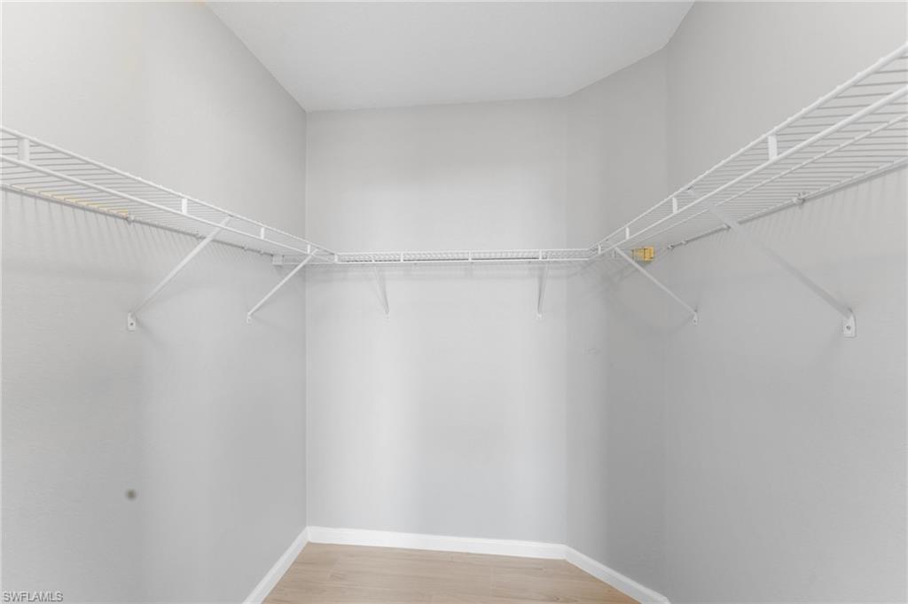 12920 Positano Circle, Unit 303 Naples, FL 34105 - Photo 12 of 21 a view of an empty walk in closet